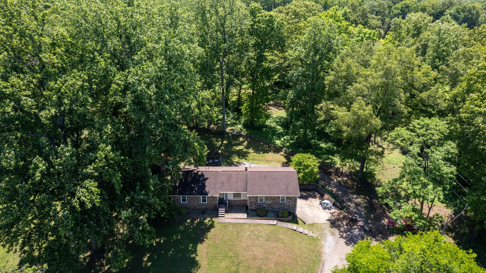 268 Raymond Hodges Road Cottontown, TN 37048 - Photo 38 of 38 an aerial view of a house with swimming pool and garden view