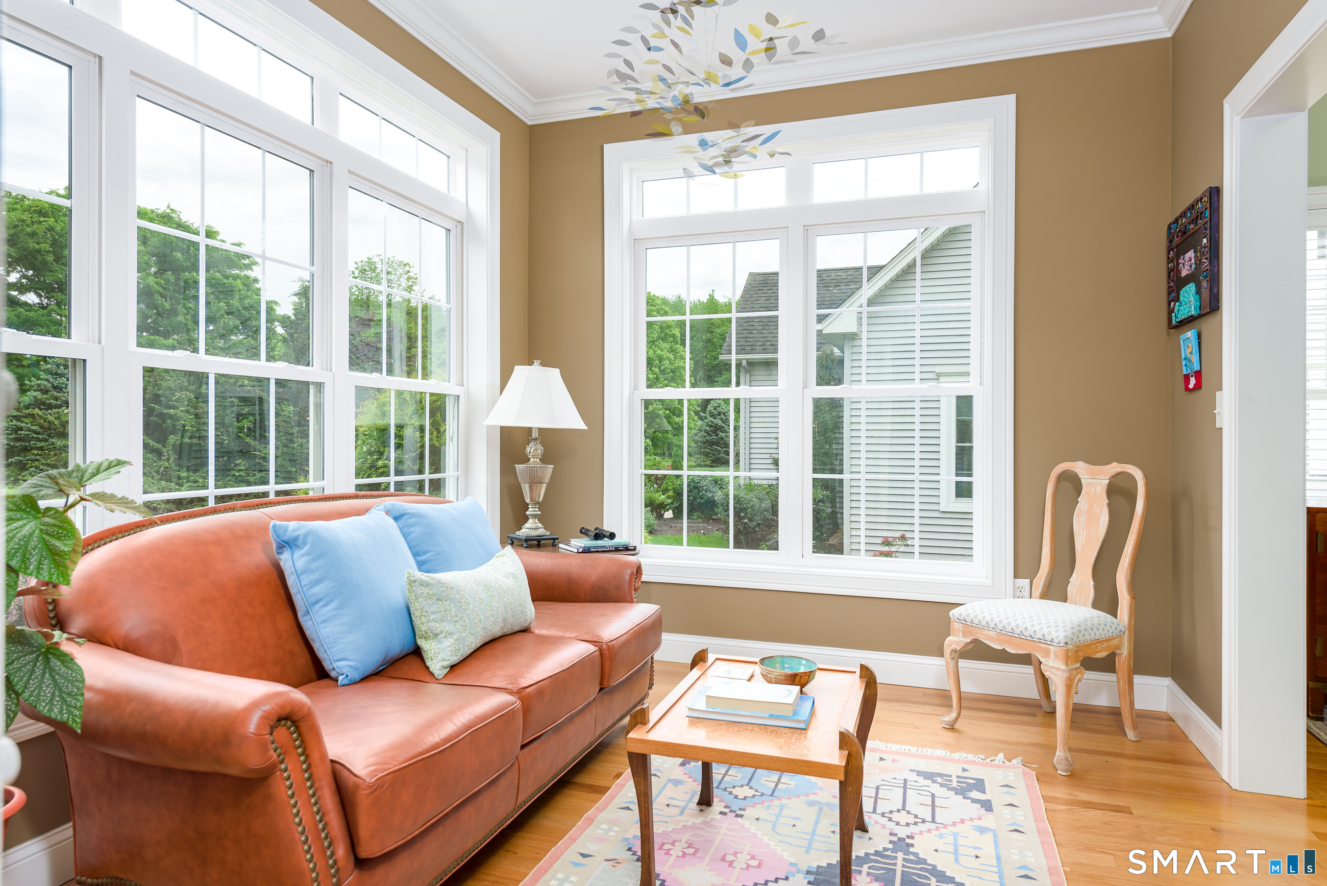 8 Greendale Drive, Unit 8 Suffield, CT 06078 - Photo 10 of 40 a living room with furniture and a large window