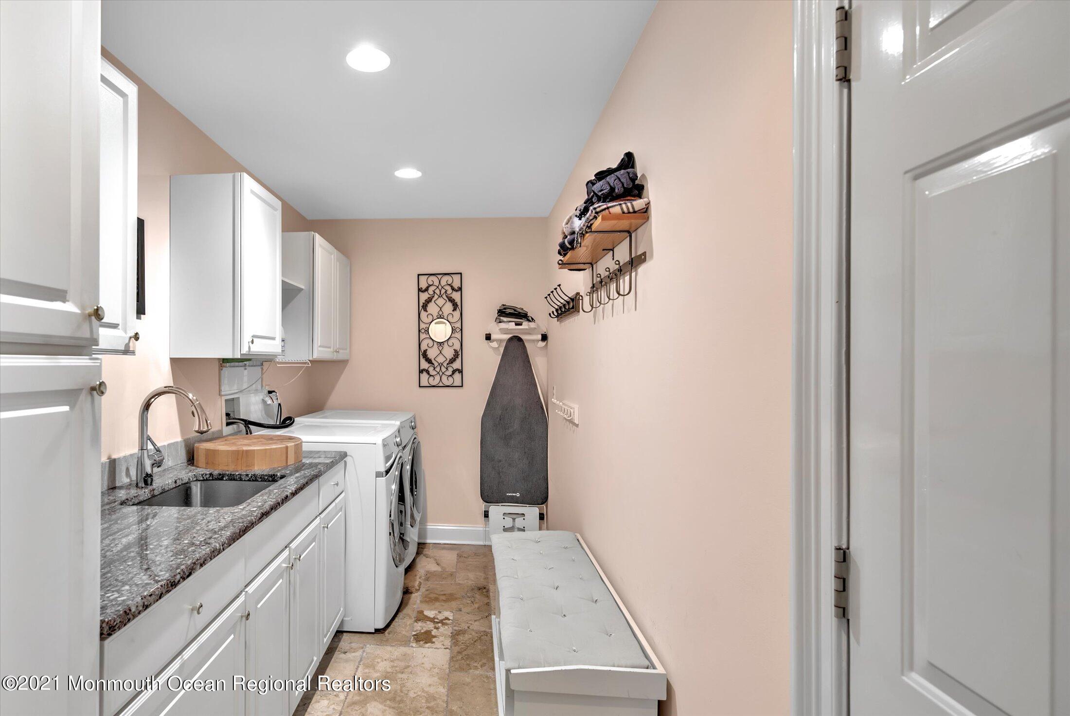 74 Sargent Road Freehold, NJ 07728 - Photo 12 of 23 a kitchen with a sink and cabinets