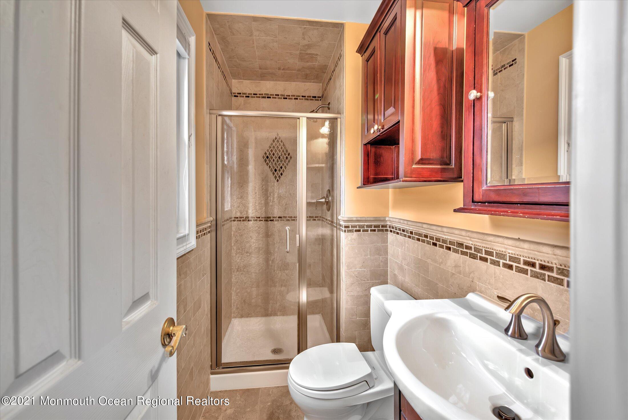 74 Sargent Road Freehold, NJ 07728 - Photo 14 of 23 a bathroom with a sink a toilet and shower