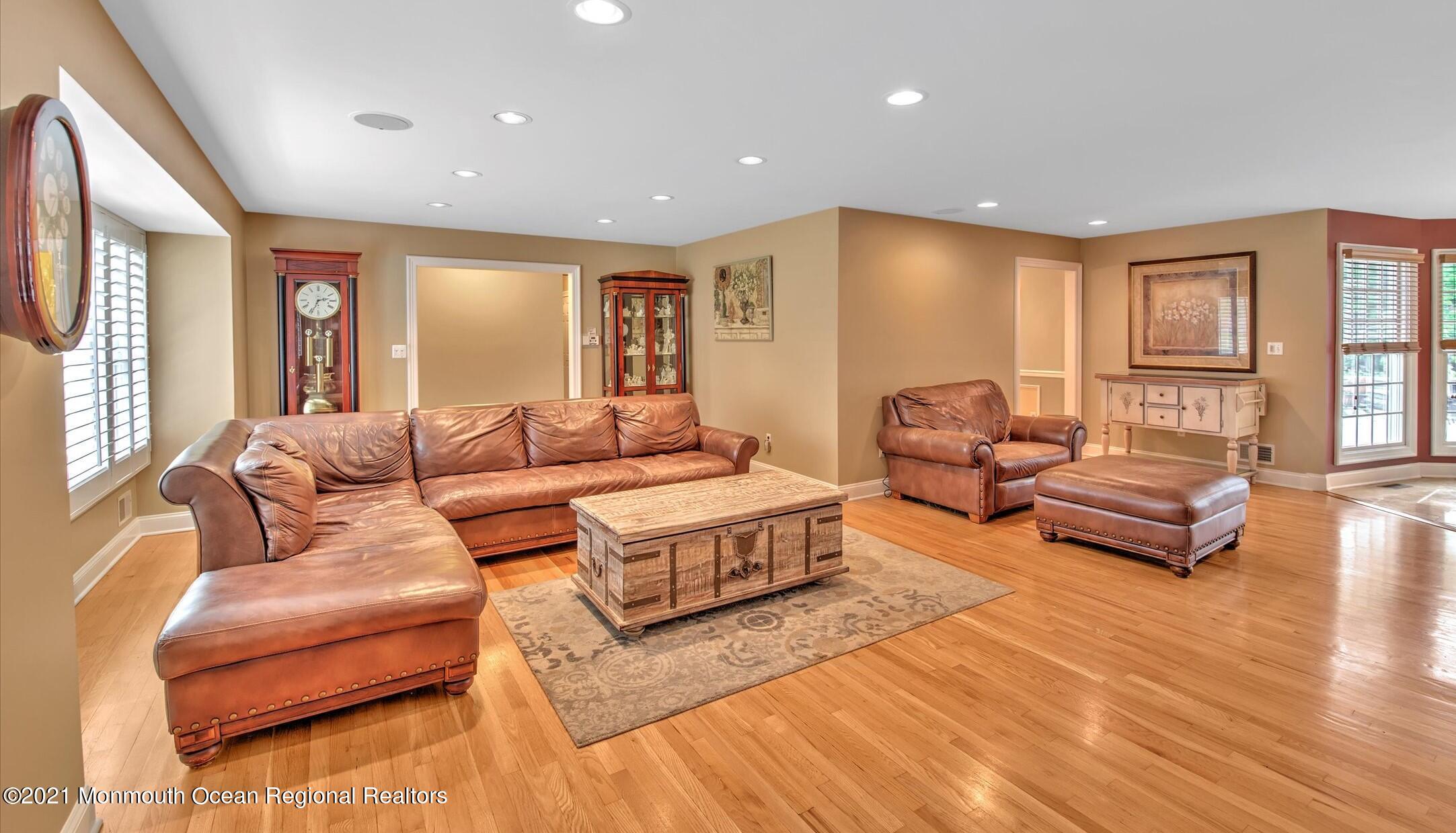 74 Sargent Road Freehold, NJ 07728 - Photo 3 of 23 a living room with furniture and a wooden floor