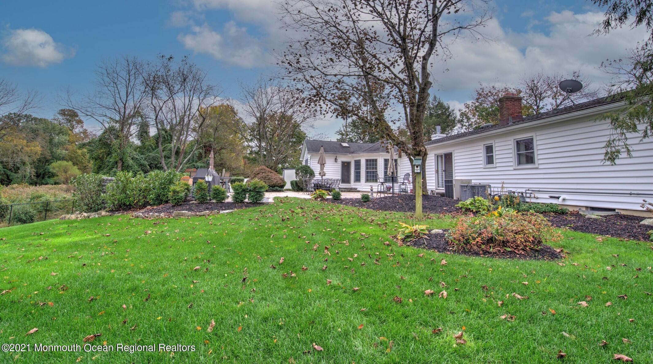 74 Sargent Road Freehold, NJ 07728 - Photo 22 of 23 a front view of a house with garden