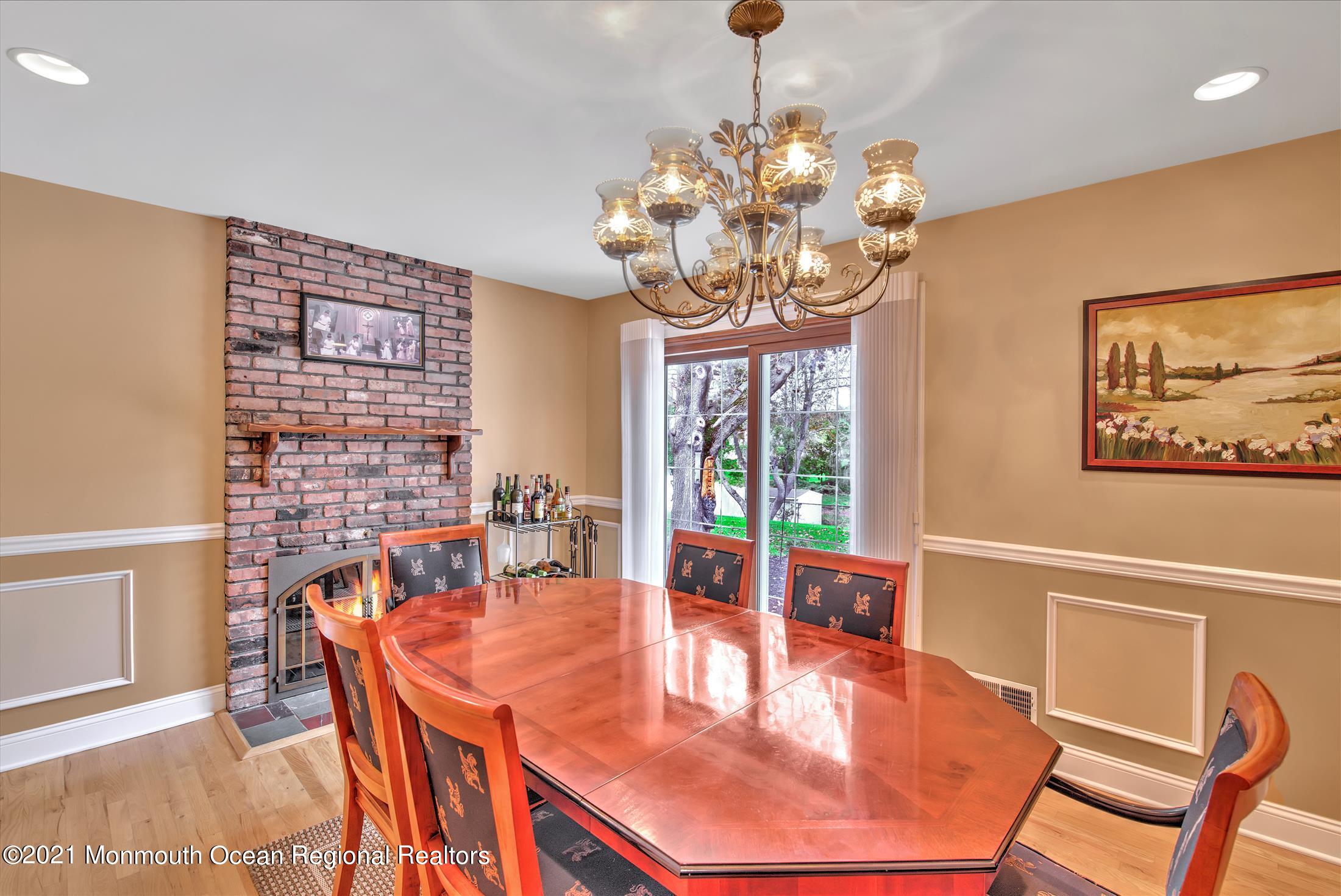 74 Sargent Road Freehold, NJ 07728 - Photo 4 of 23 a view of a dining room with furniture wooden floor and chandelier