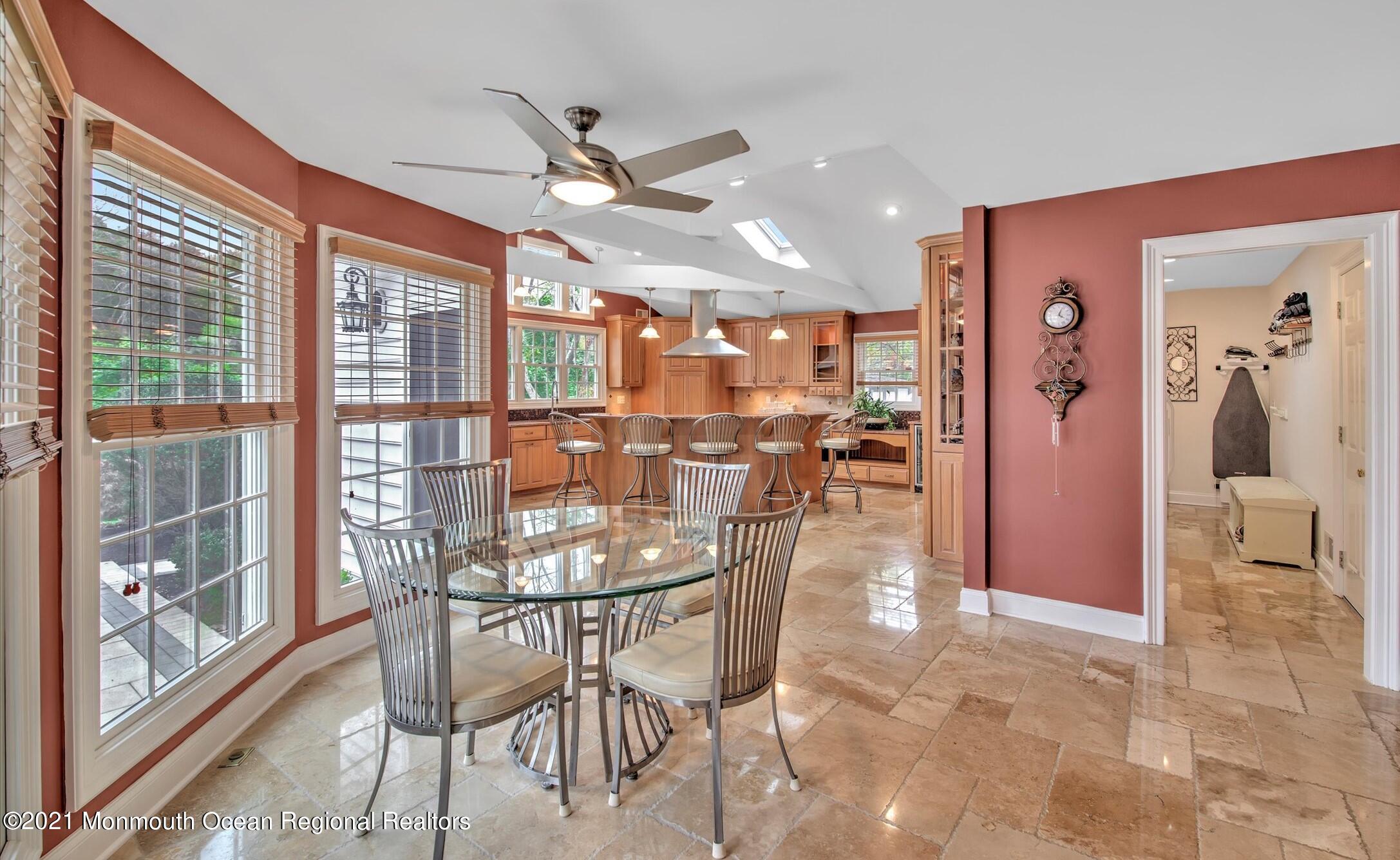74 Sargent Road Freehold, NJ 07728 - Photo 5 of 23 a view of a dining room and livingroom with furniture wooden floor a chandelier