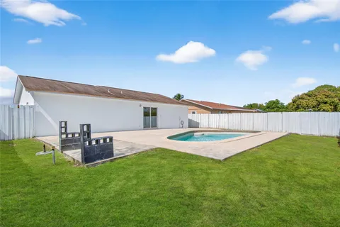 a view of a backyard with furniture