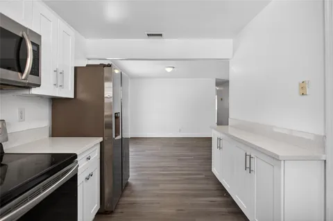 a view of storage and utility room with washer and dryer