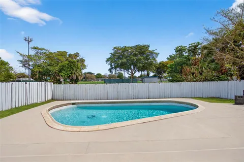 a view of a backyard with a small pool