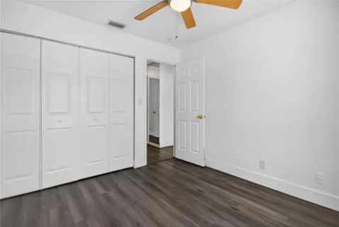 a view of an entryway with wooden floor