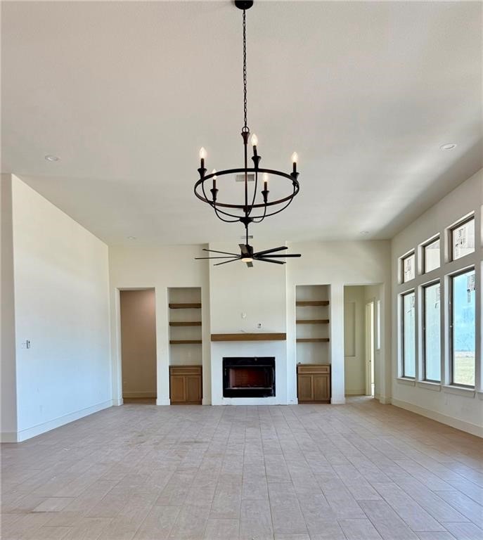 1470 Y O Ranch Drive Corpus Christi, TX 78415 - Photo 11 of 12 a view of a room with a fireplace cabinet and windows