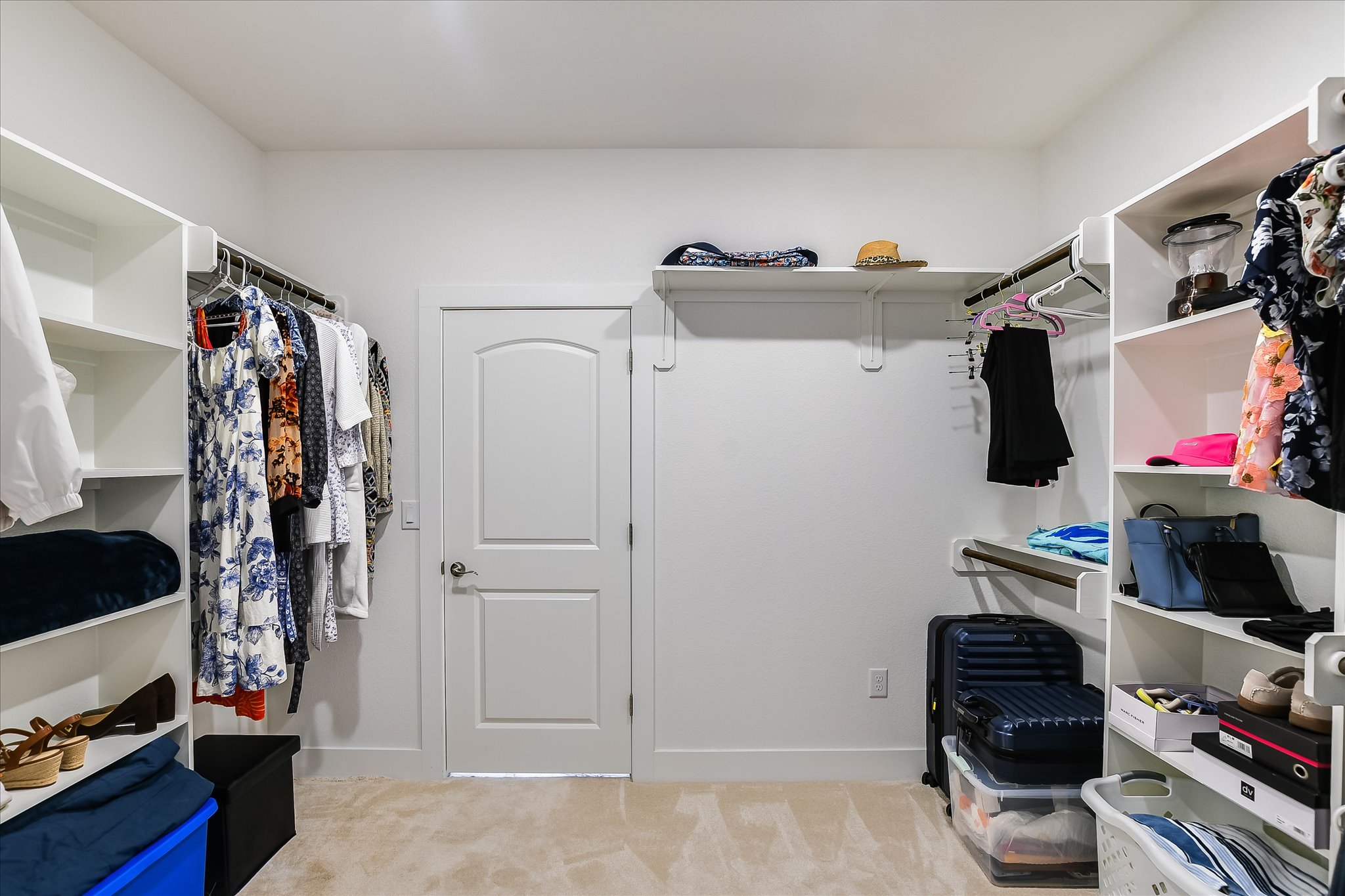 19920 Old Burnet Road Jonestown, TX 78645 - Photo 17 of 29 Primary bedroom walk-in closet (half view) has doors to master bath and laundry room