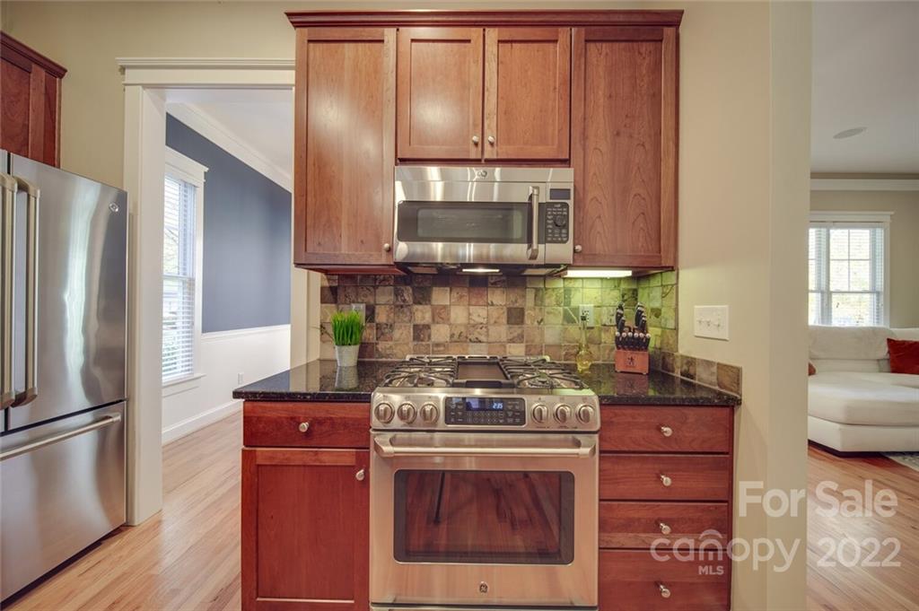 220 Mills Lane Fort Mill, SC 29708 - Photo 12 of 42 a kitchen with stainless steel appliances granite countertop a stove and a refrigerator