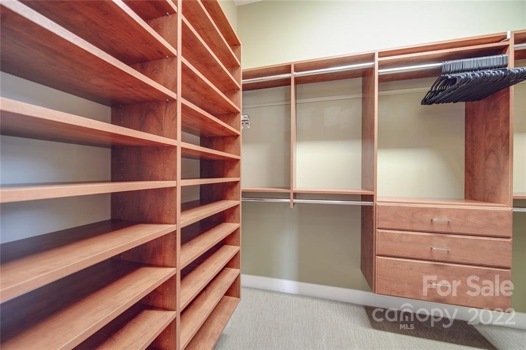 220 Mills Lane Fort Mill, SC 29708 - Photo 18 of 42 a view of walk in closet with empty racks