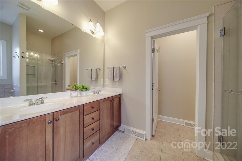 220 Mills Lane Fort Mill, SC 29708 - Photo 19 of 42 a bathroom with a double vanity sink and a mirror