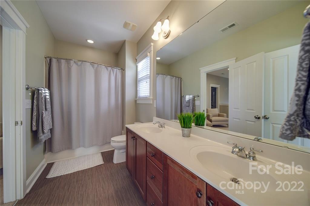 220 Mills Lane Fort Mill, SC 29708 - Photo 25 of 42 a spacious bathroom with a double vanity sink and a mirror