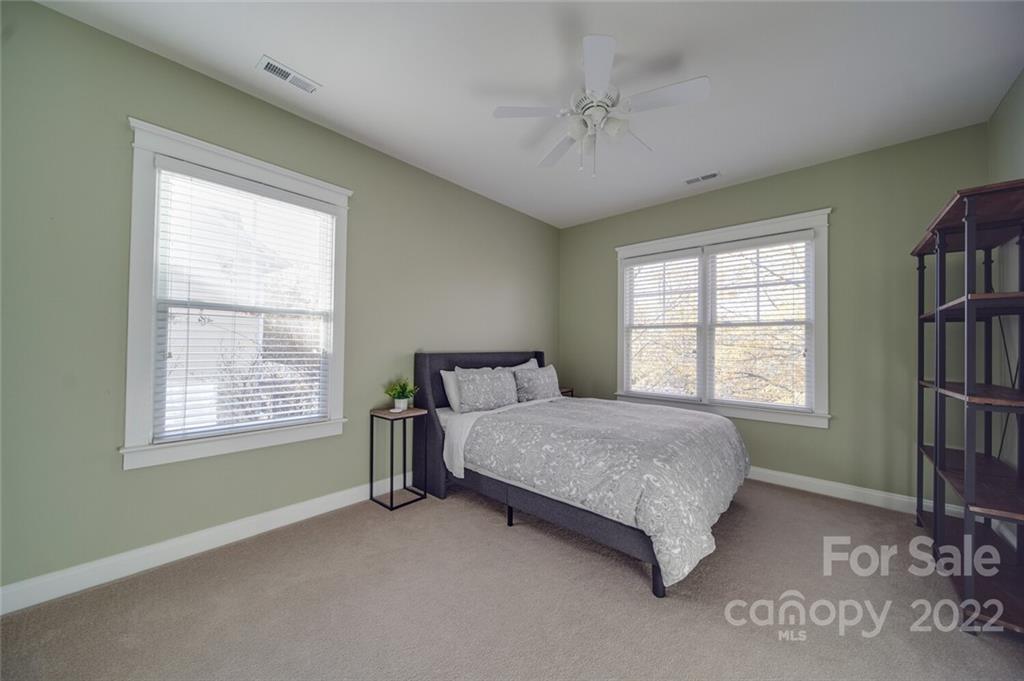 220 Mills Lane Fort Mill, SC 29708 - Photo 26 of 42 a spacious bedroom with a bed and a window