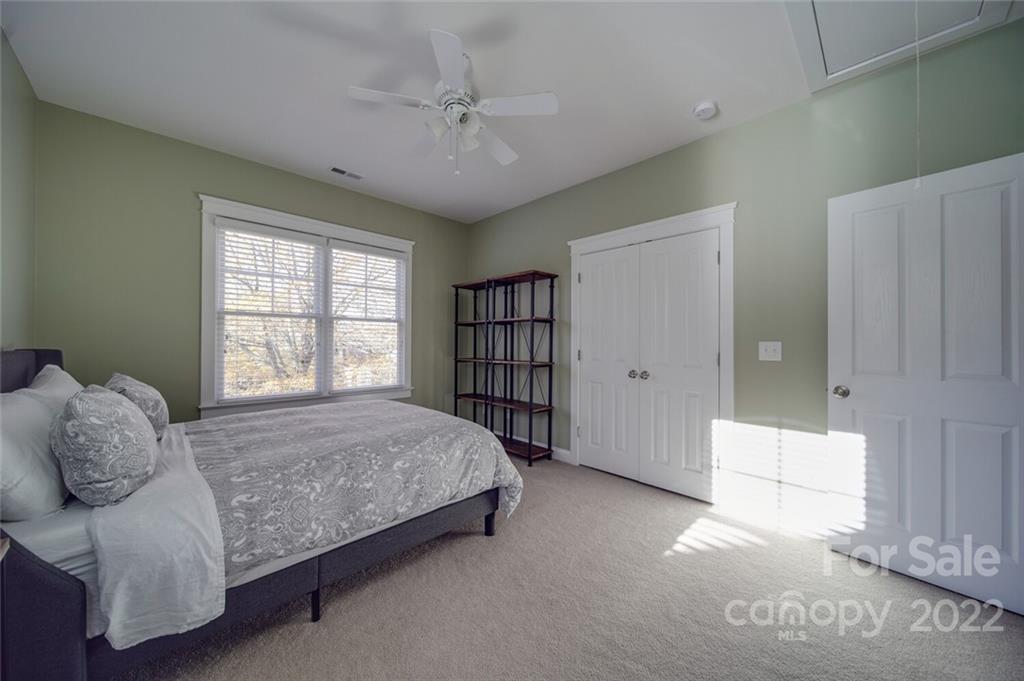 220 Mills Lane Fort Mill, SC 29708 - Photo 27 of 42 a spacious bedroom with a bed and a window