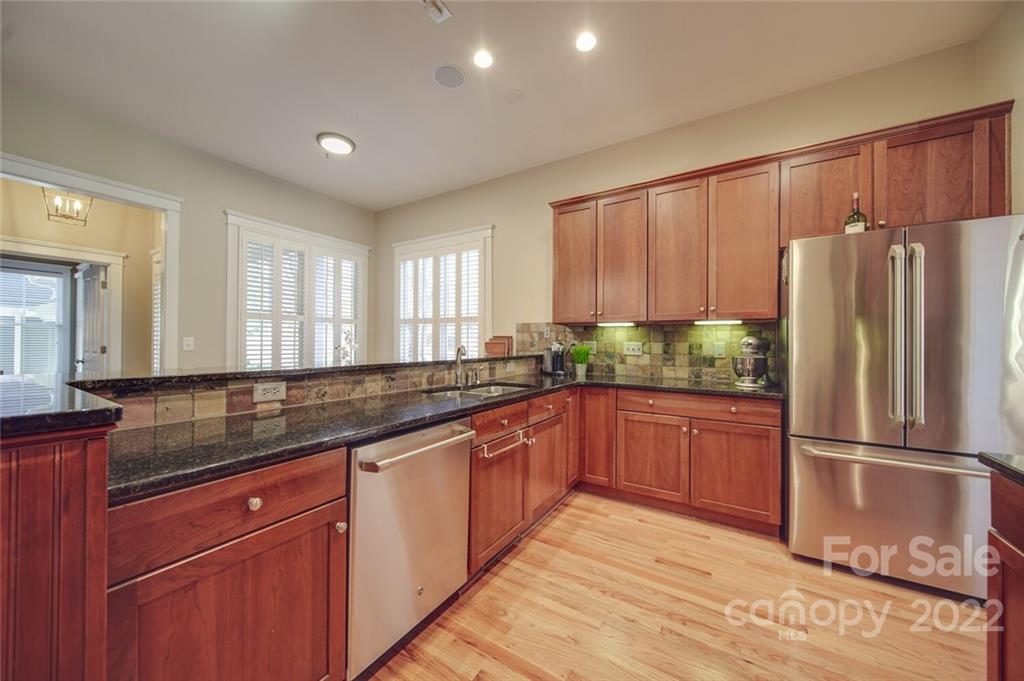 220 Mills Lane Fort Mill, SC 29708 - Photo 10 of 42 a kitchen with stainless steel appliances granite countertop a refrigerator and a sink