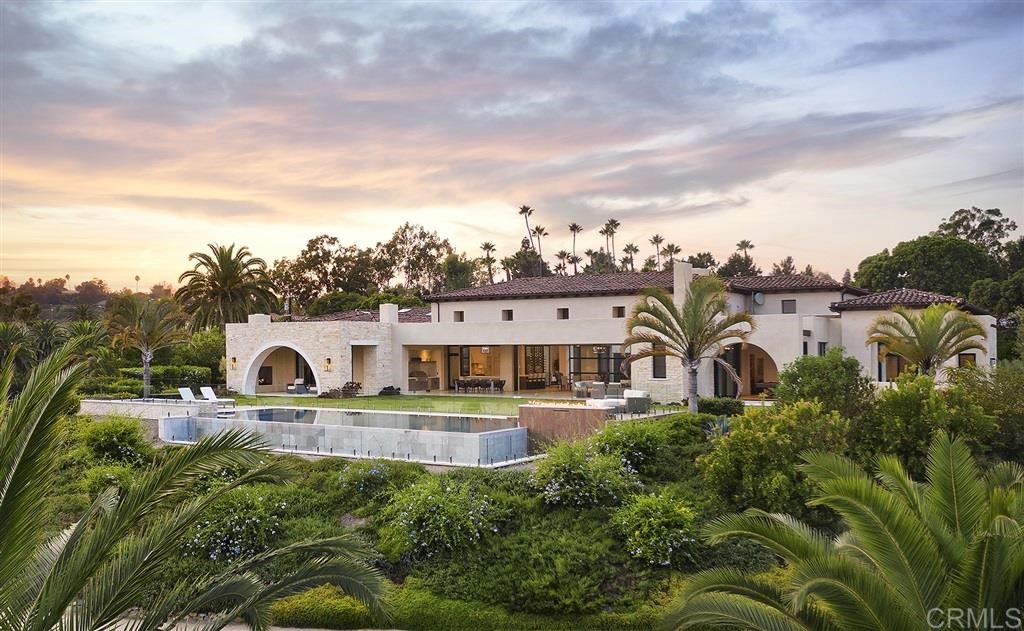 16568 La Gracia Rancho Santa Fe, CA 92067 - Photo 1 of 25 a view of a big house with pool and plants