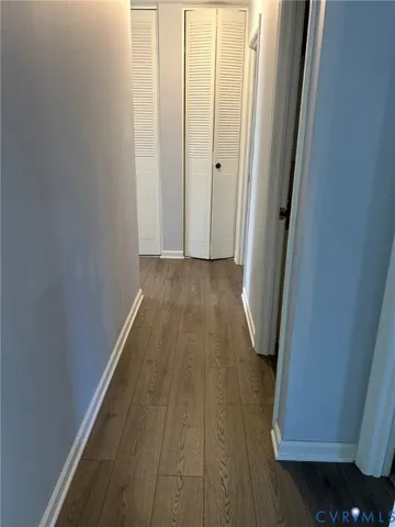 a view of a room with wooden floor and staircase