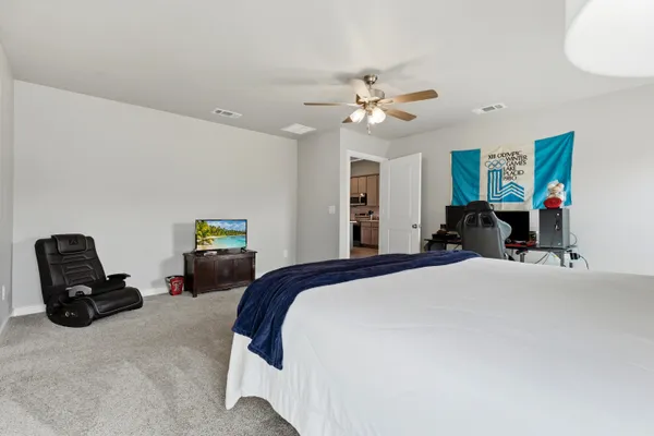 a bedroom with a bed and furniture