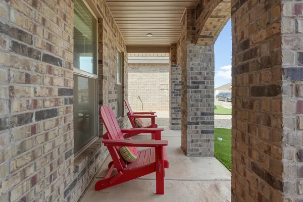 a couple of chairs sitting in front of a door