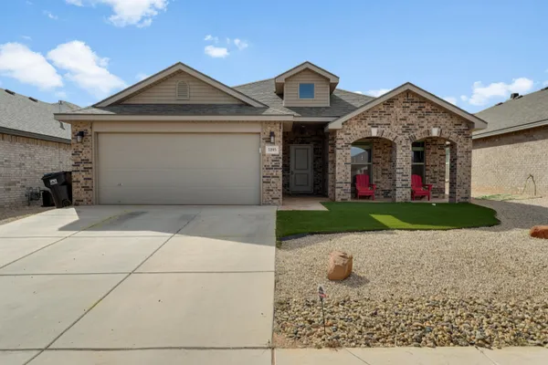 a front view of a house with yard