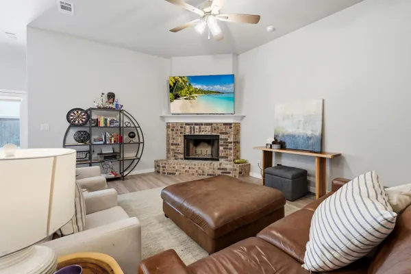 a living room with furniture and a fireplace