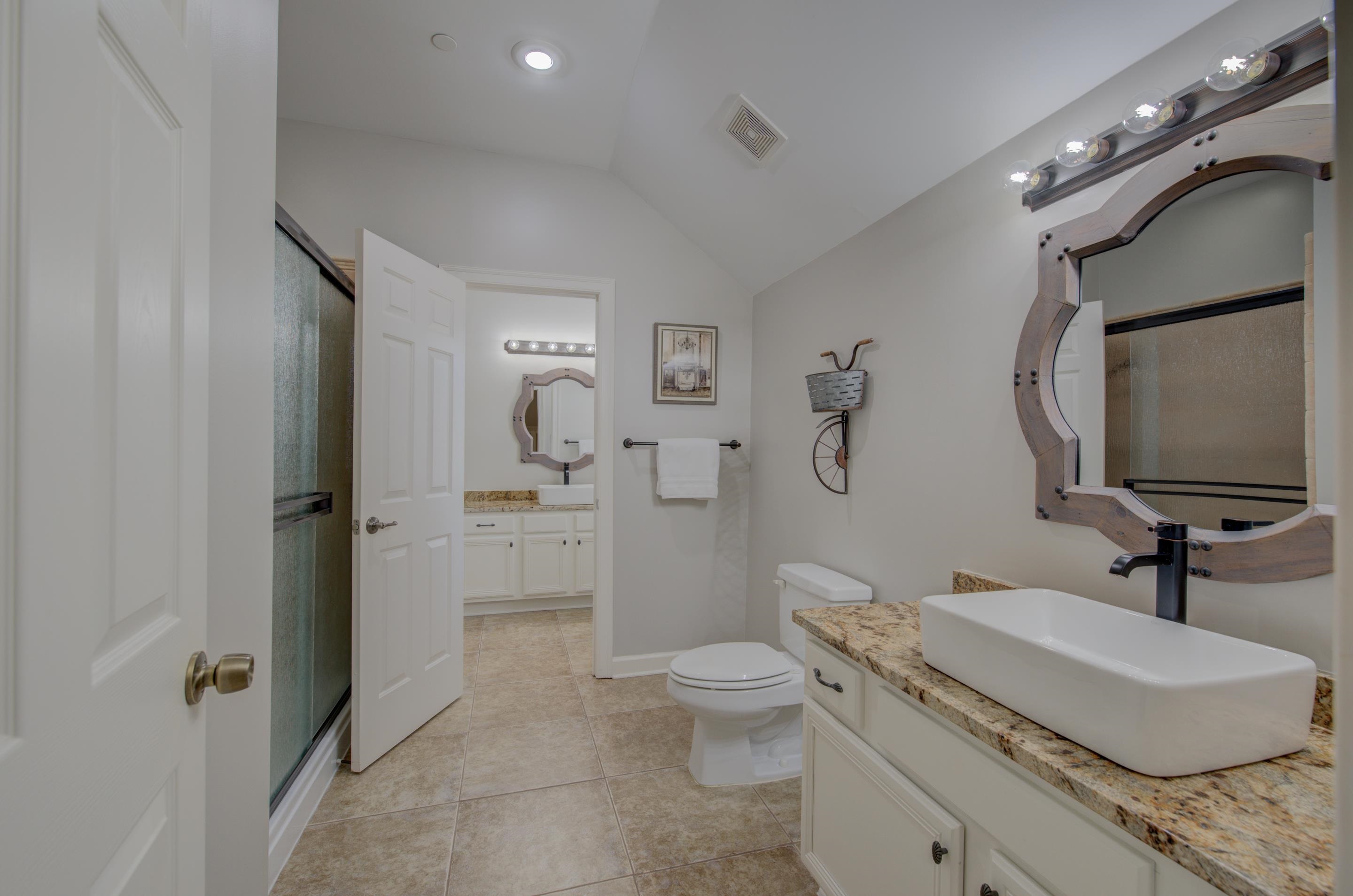 3474 Brooke Edge Lane Collierville, TN 38017 - Photo 19 of 25 a spacious bathroom with a granite countertop sink mirror vanity and toilet