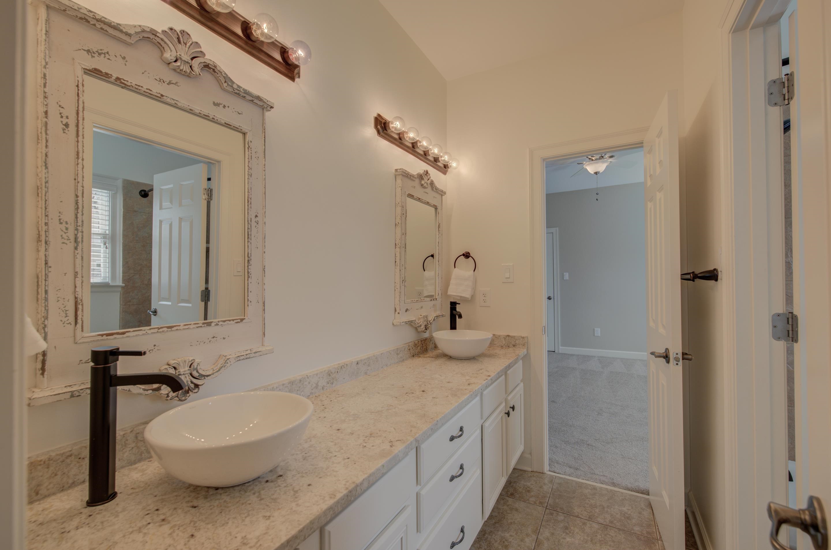 3474 Brooke Edge Lane Collierville, TN 38017 - Photo 21 of 25 a bathroom with a granite countertop double vanity sink and a mirror