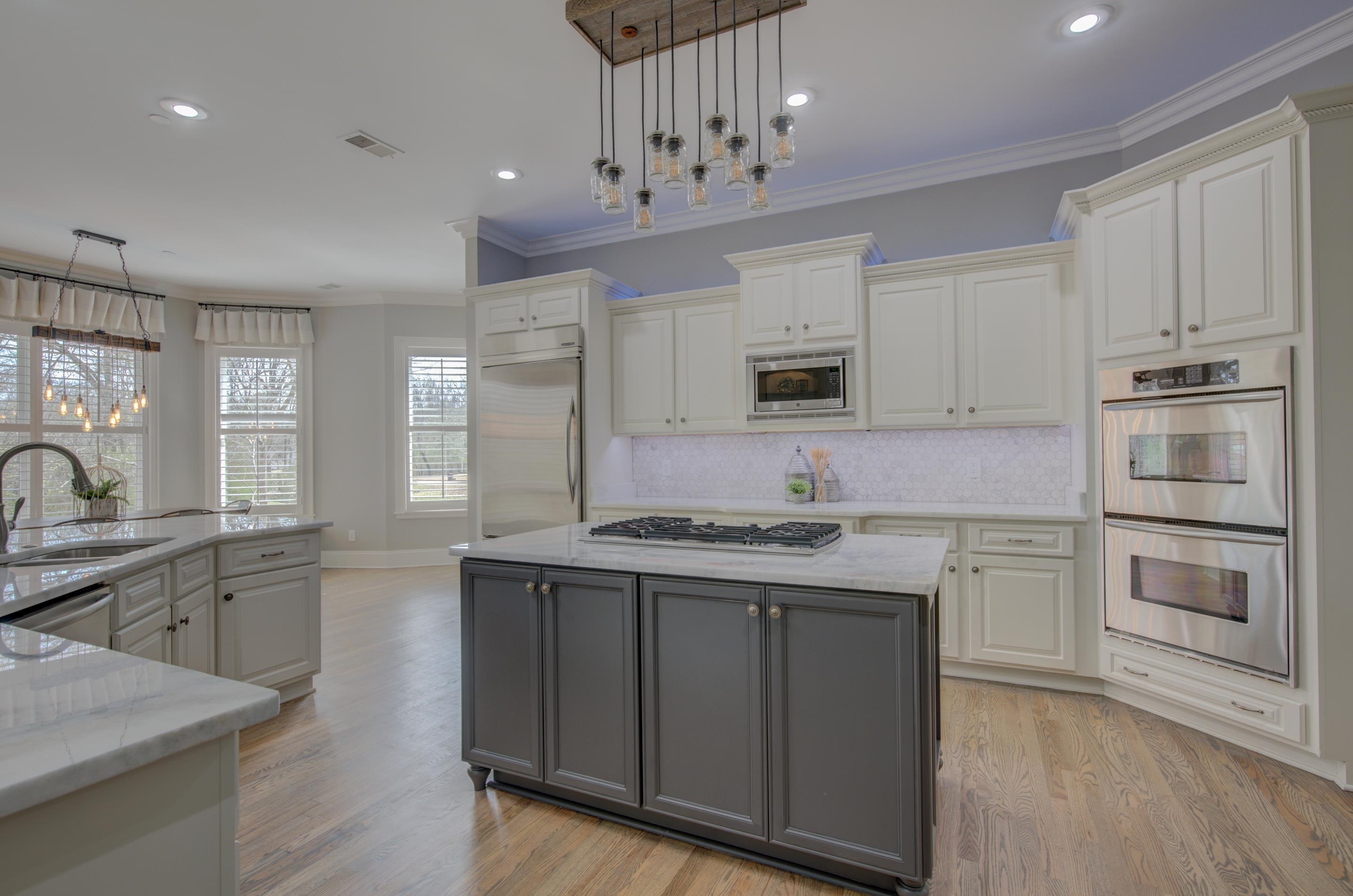 3474 Brooke Edge Lane Collierville, TN 38017 - Photo 8 of 25 a kitchen with a sink stove and cabinets