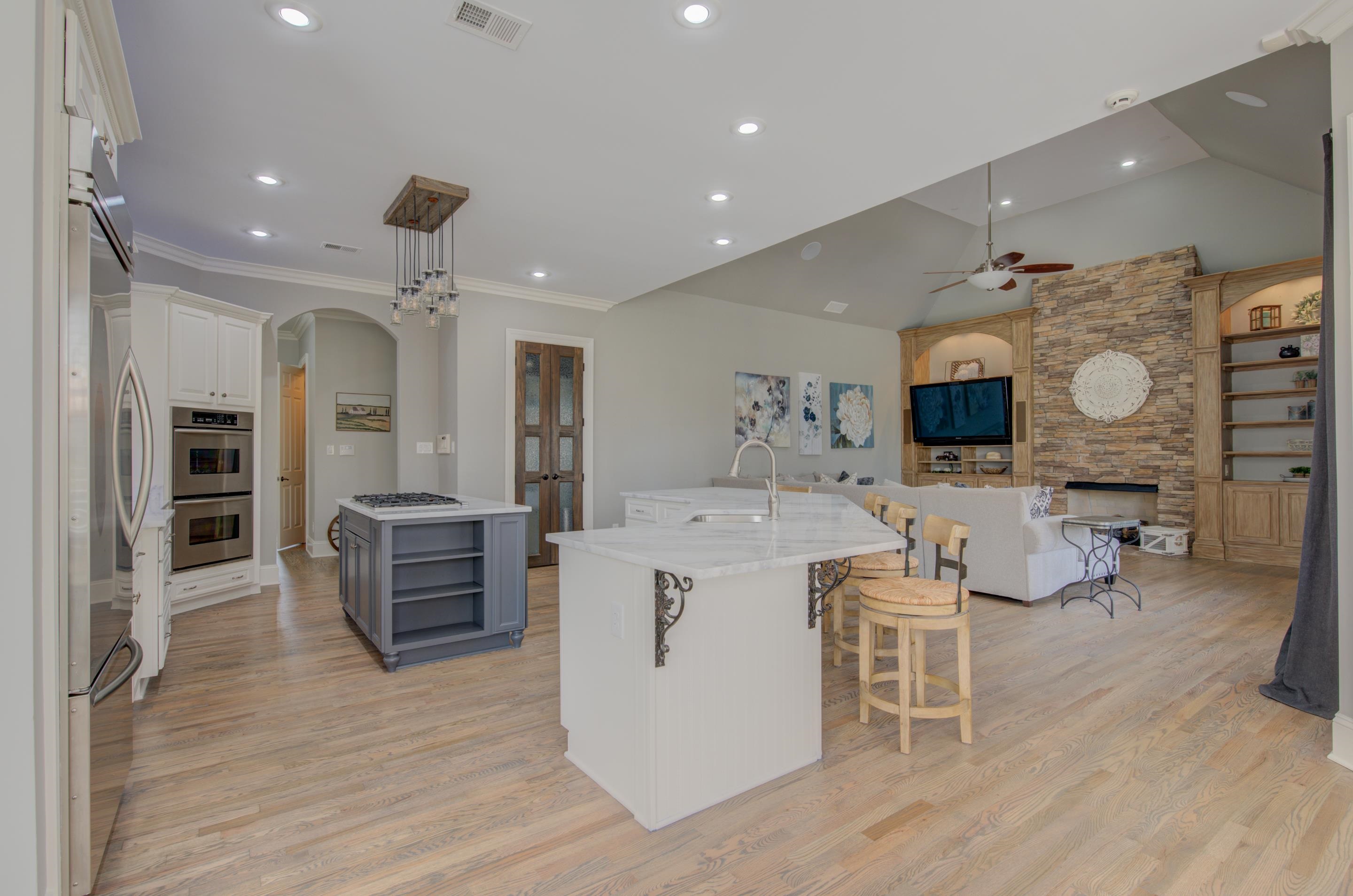 3474 Brooke Edge Lane Collierville, TN 38017 - Photo 9 of 25 a living room with furniture a flat screen tv and kitchen view