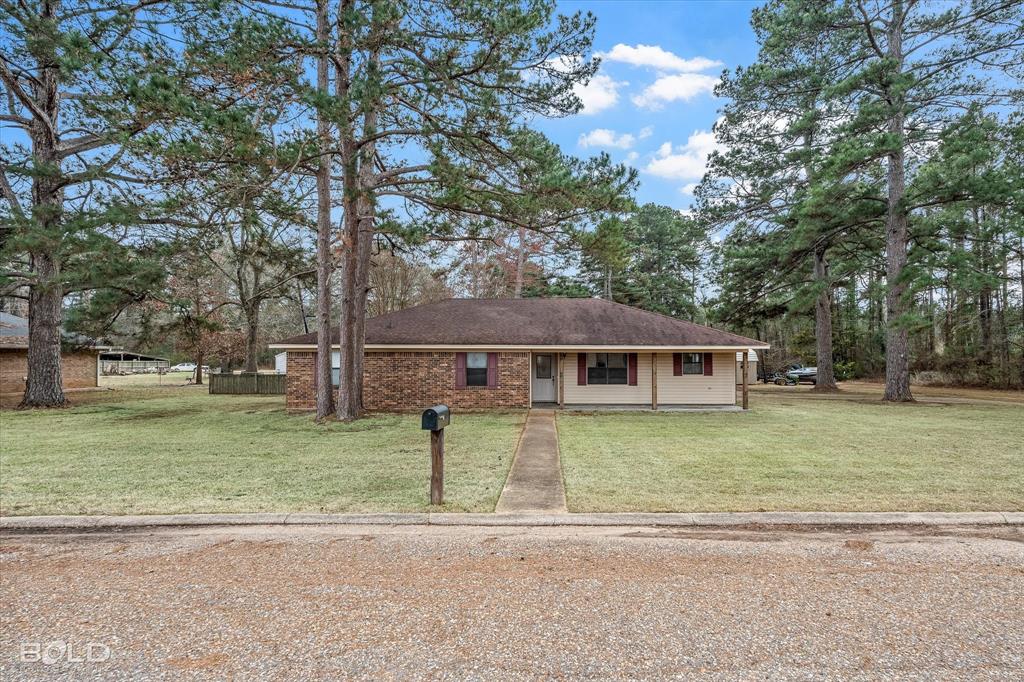 103 Arkla Drive Springhill, LA 71075 - Photo 1 of 1 a front view of a house with a yard