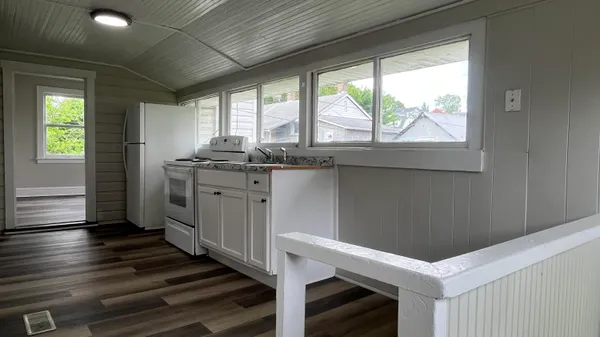 a kitchen with sink and window