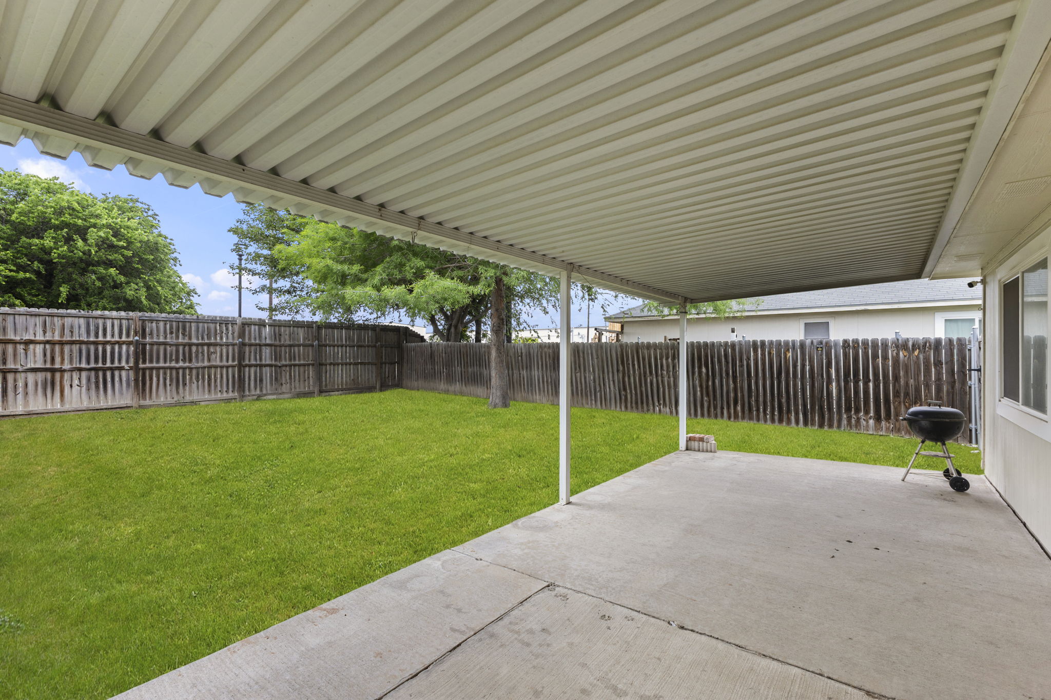 290 Bailey Loop Kyle, TX 78640 - Photo 28 of 33 Spacious covered patio featuring a corrugated metal roof and concrete slab flooring