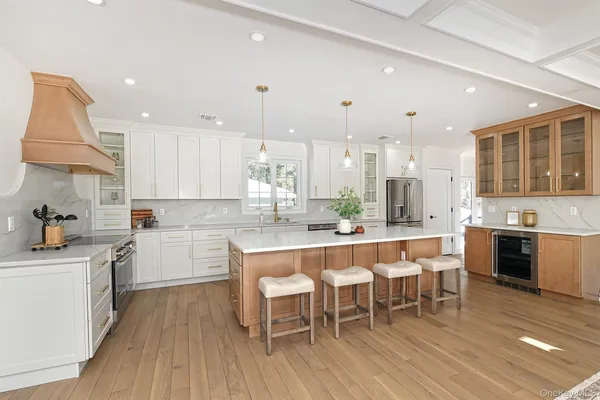 a large kitchen with a table and chairs in it