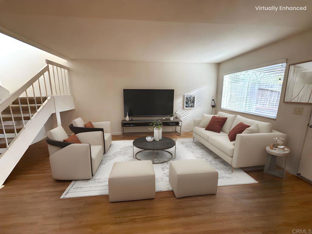 9575 Easter Way, Unit 5 San Diego, CA 92121 - Photo 1 of 19 a living room with furniture and a flat screen tv