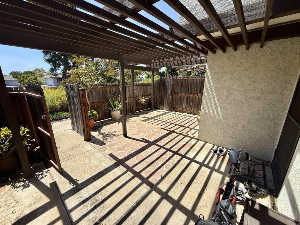 9575 Easter Way, Unit 5 San Diego, CA 92121 - Photo 12 of 19 a view of a patio with wooden floor