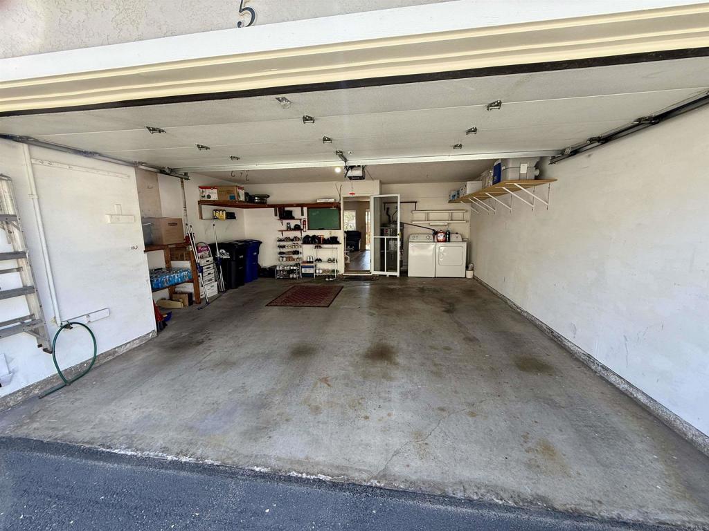 9575 Easter Way, Unit 5 San Diego, CA 92121 - Photo 13 of 19 a view of a garage with furniture