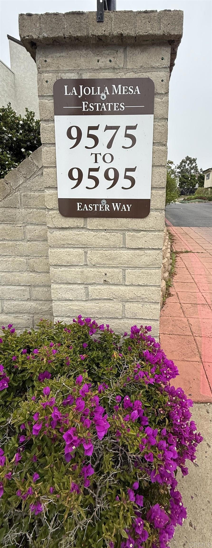 9575 Easter Way, Unit 5 San Diego, CA 92121 - Photo 15 of 19 a view of a house with a lot of flowers