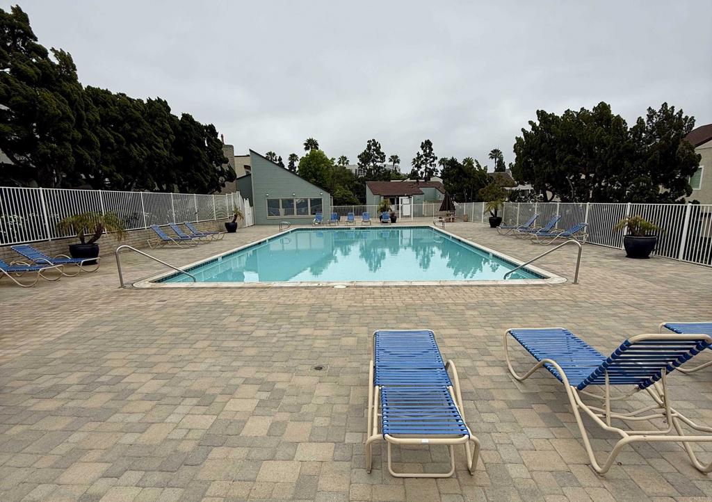 9575 Easter Way, Unit 5 San Diego, CA 92121 - Photo 19 of 19 a picture of table and chairs with wooden fence