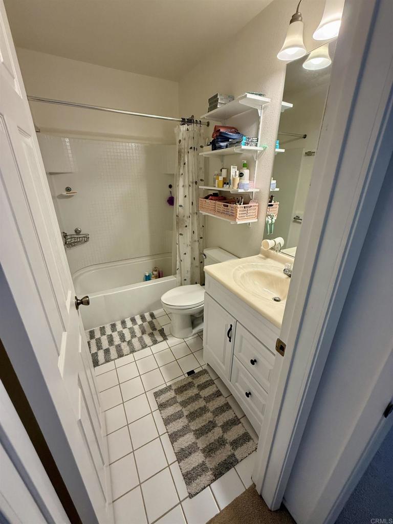 9575 Easter Way, Unit 5 San Diego, CA 92121 - Photo 8 of 19 a bathroom with a sink a toilet and shower