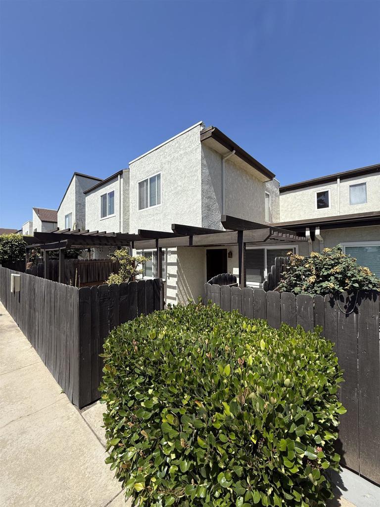 9575 Easter Way, Unit 5 San Diego, CA 92121 - Photo 10 of 19 a view of a house with a backyard