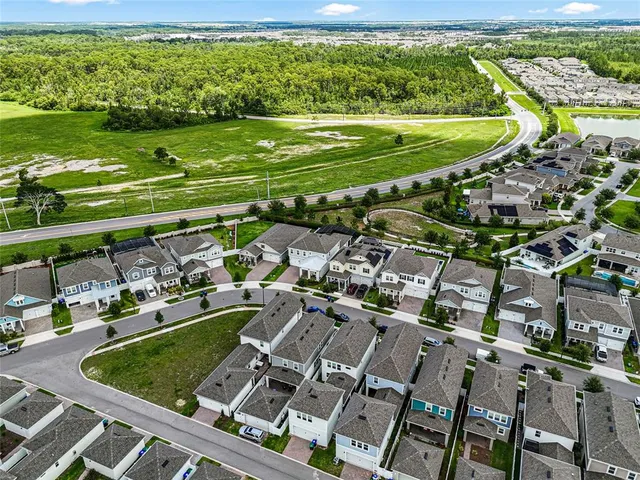 a view of a backyard with sitting area