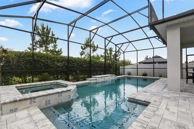 a view of a swimming pool with a patio