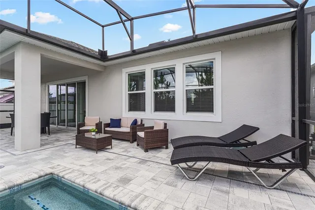 a living room with furniture and a window