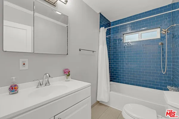 a bathroom with a sink toilet and bathtub