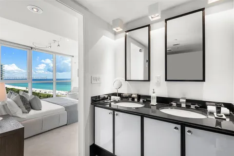 a bathroom with a double vanity sink and mirror