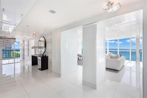 a view of living room with furniture and entryway