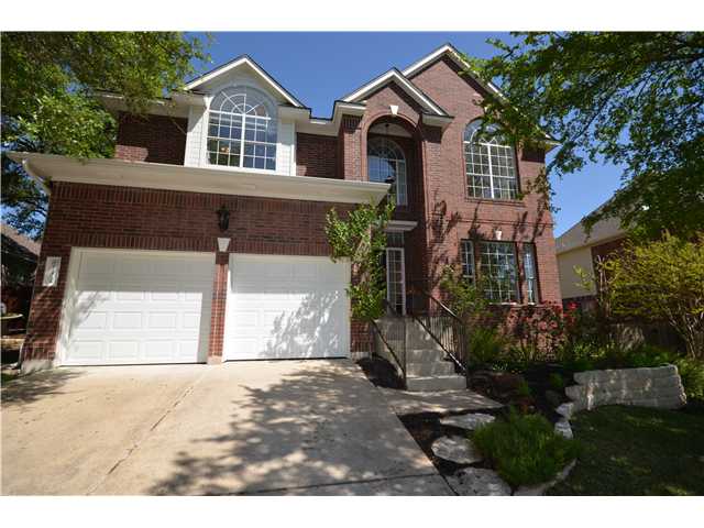 10724 Chestnut Ridge Road Austin, TX 78726 - Photo 1 of 1 a view of a house with a yard