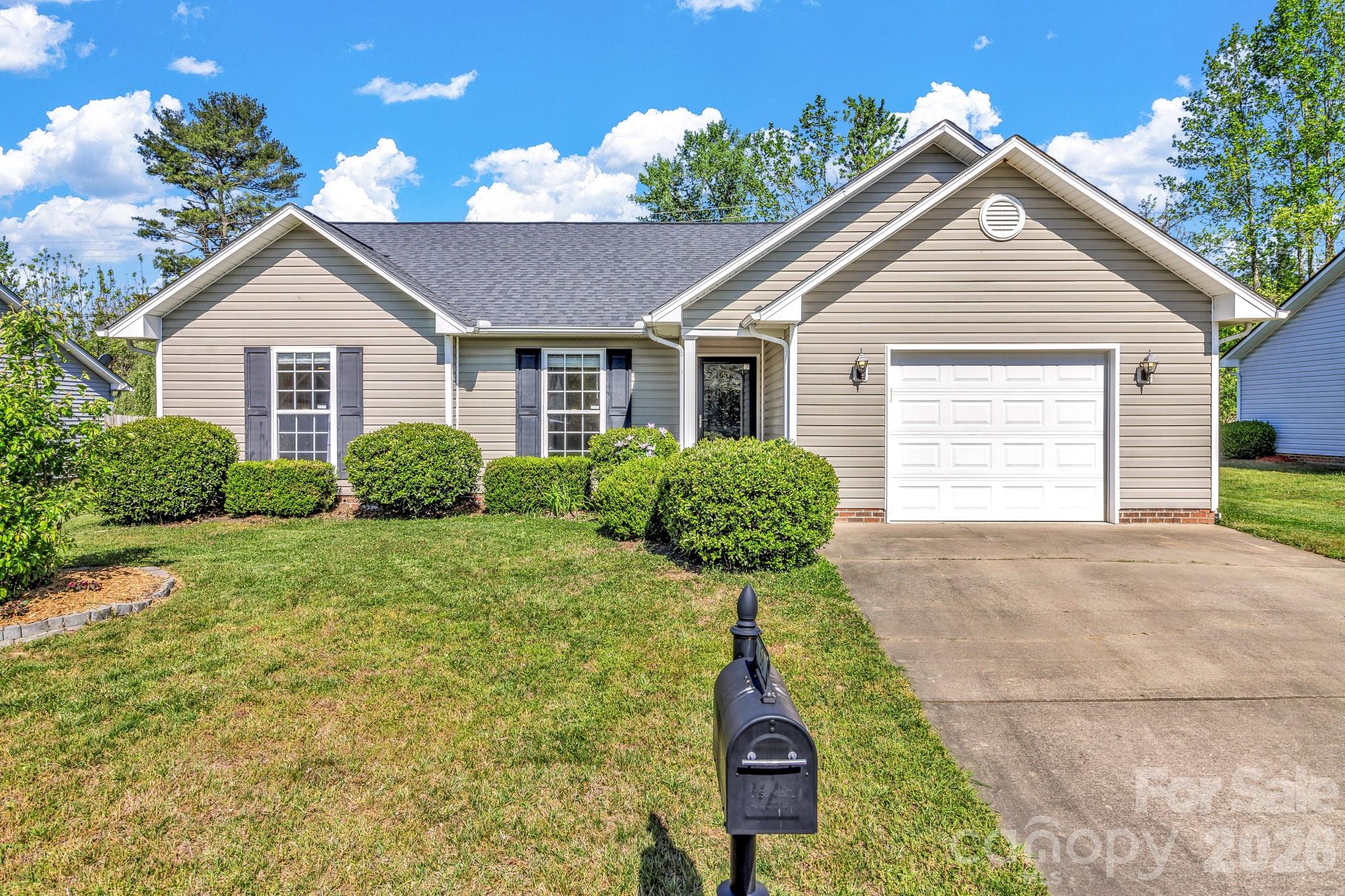 58 South Sunberry Trail Fletcher, NC 28732 - Photo 1 of 41 a house view with a garden space
